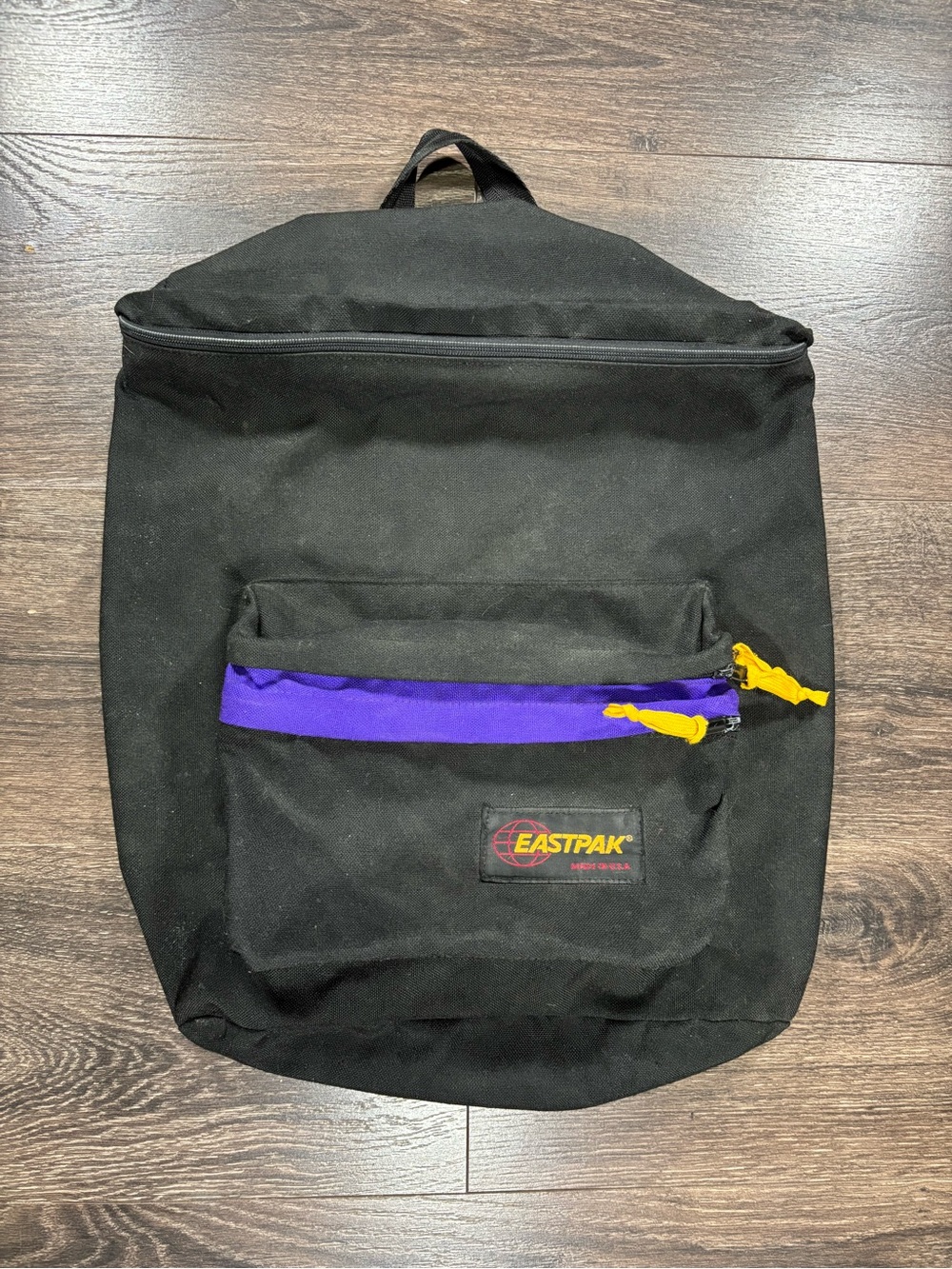 Eastpak Black Backpack with Purple Trim and Yellow Pulls